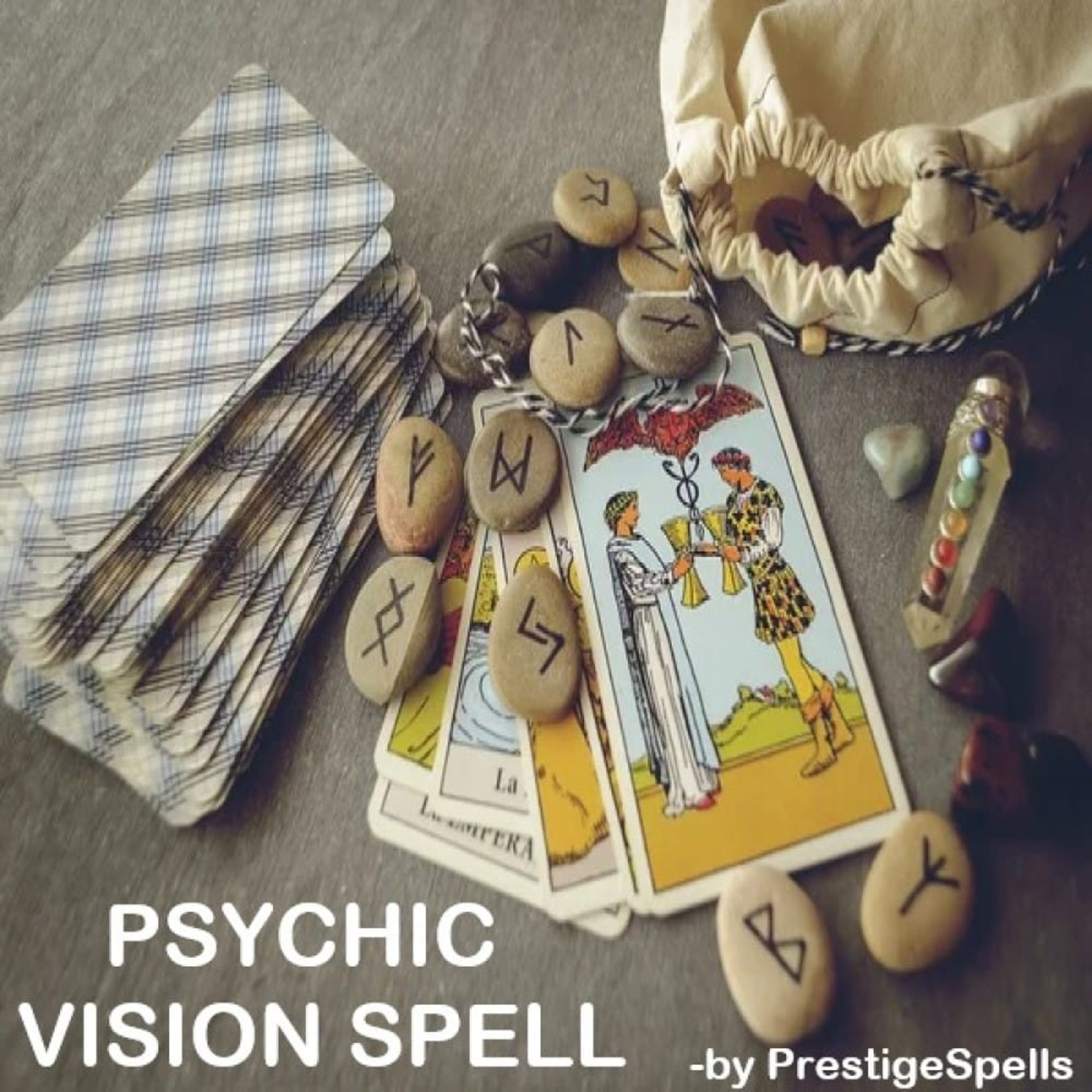 runes and tarot cards psychic items sitting next to a small tan cloth drawstring bag on a brown table background