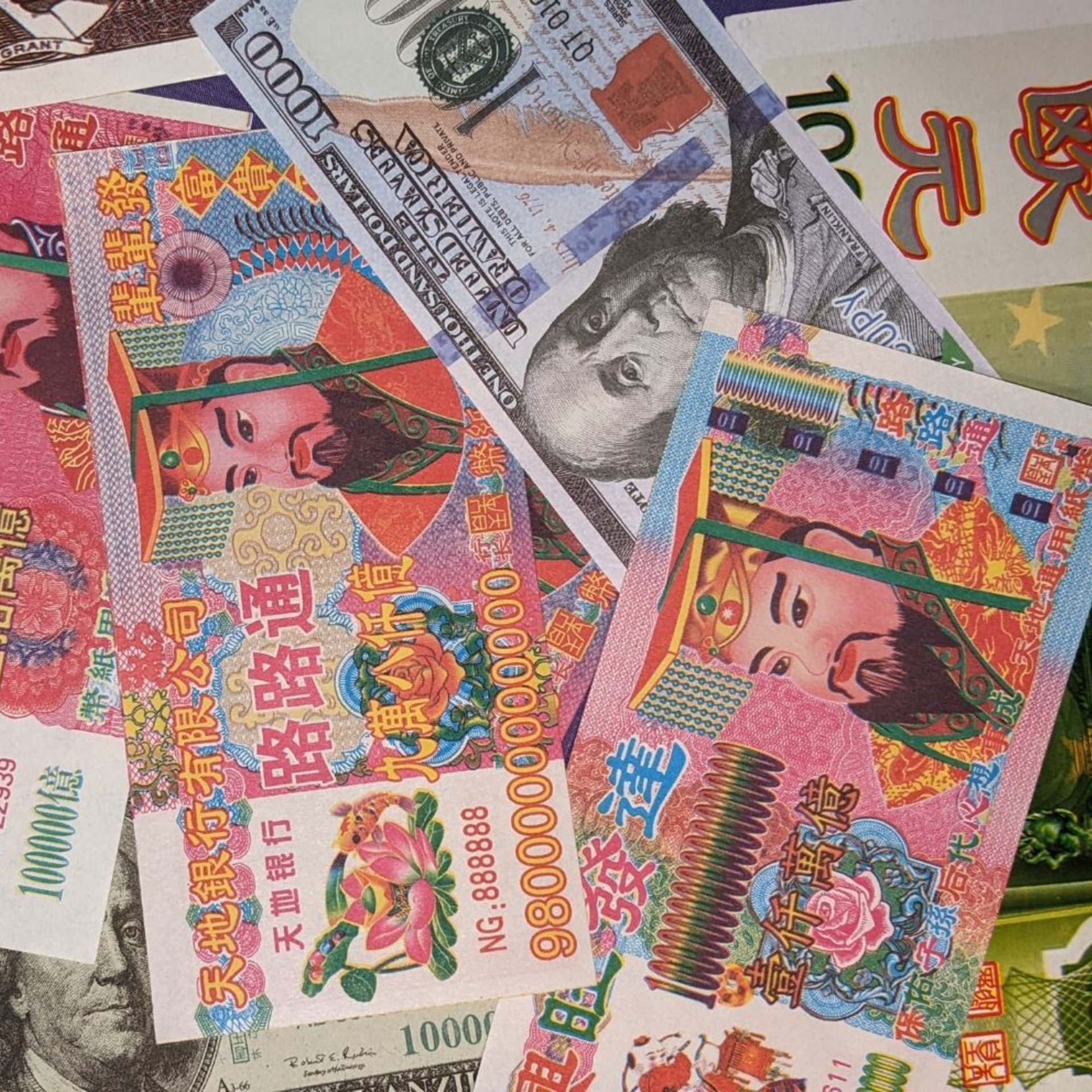 various colored joss paper notes spread out in a pile